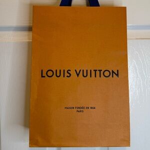 Louis Vuitton shopping bag 14” x 9.75” x 4.25”.
